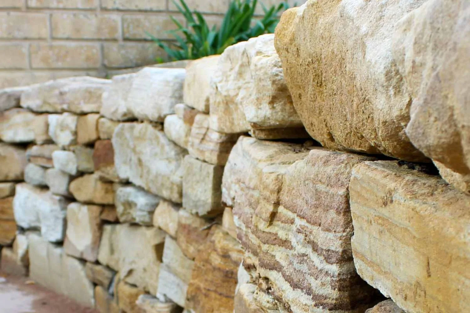 Close-up of a natural sandstone block retaining wall